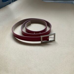 Red patent leather “skinny” belt